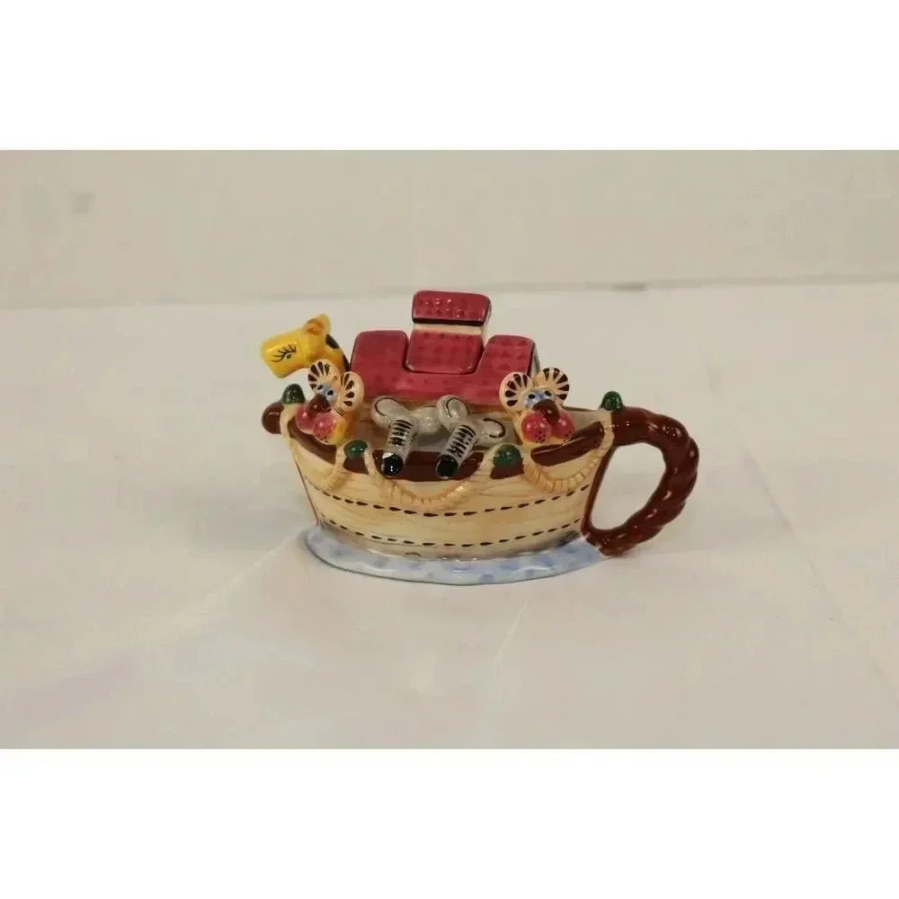 vintage animals in the boat tea pot